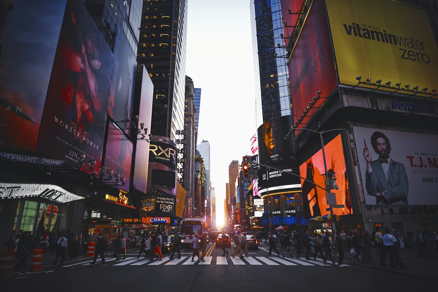 Towering outdoor advertising billboards lit at night — representative image